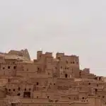 Cyclist riding through Taroudant Province, exploring Morocco's living heritage among ancient kasbahs, Amazigh villages, and scenic gravel roads 