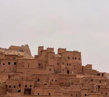 Cyclist riding through Taroudant Province, exploring Morocco's living heritage among ancient kasbahs, Amazigh villages, and scenic gravel roads 