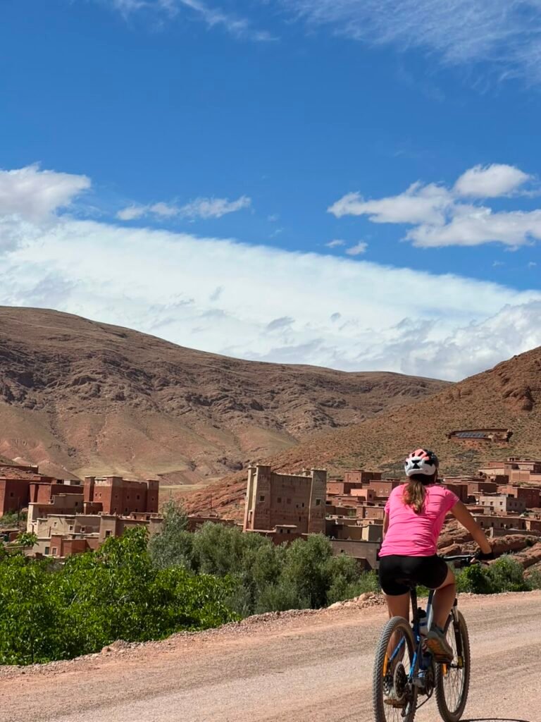 The Ultimate Guide to Exploring Morocco's Living Heritage: An Unforgettable Gravel Bike Tour Through Taroudant Province 2 Cyclist riding through Taroudant Province, exploring Morocco's living heritage among ancient kasbahs, Amazigh villages, and scenic gravel roads.