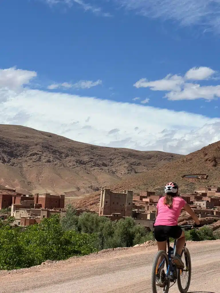 The Ultimate Guide to Exploring Morocco's Living Heritage: An Unforgettable Gravel Bike Tour Through Taroudant Province 2 Cyclist riding through Taroudant Province, exploring Morocco's living heritage among ancient kasbahs, Amazigh villages, and scenic gravel roads.